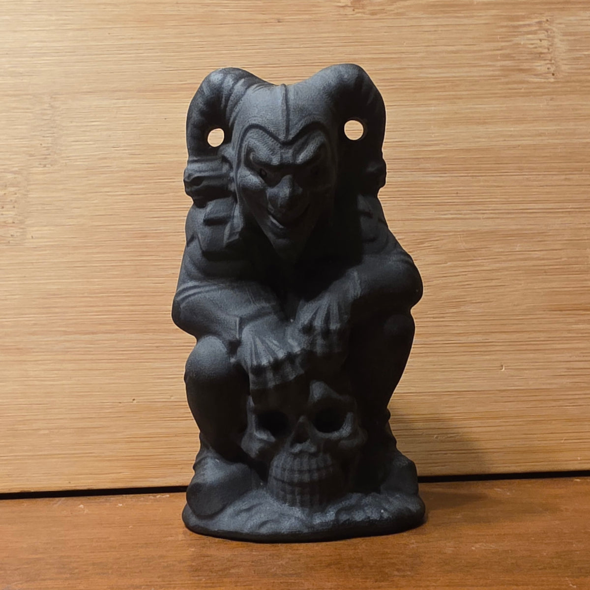 Obsidian joker on skull