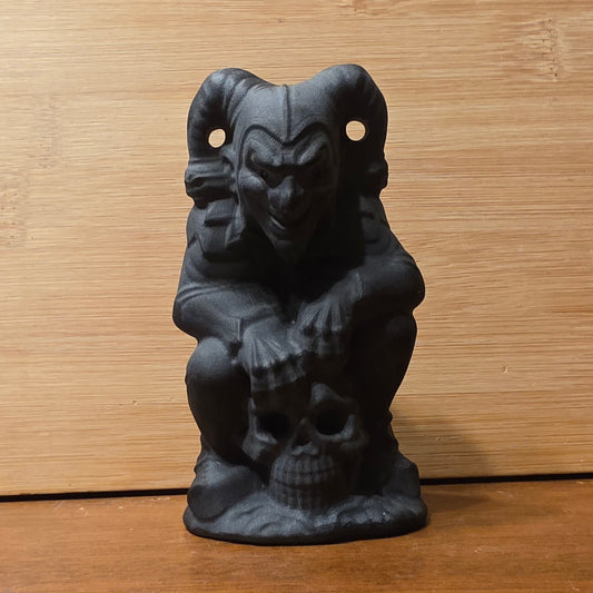 Obsidian joker on skull