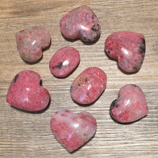 Rhodonite in Quartz hearts and palm stones